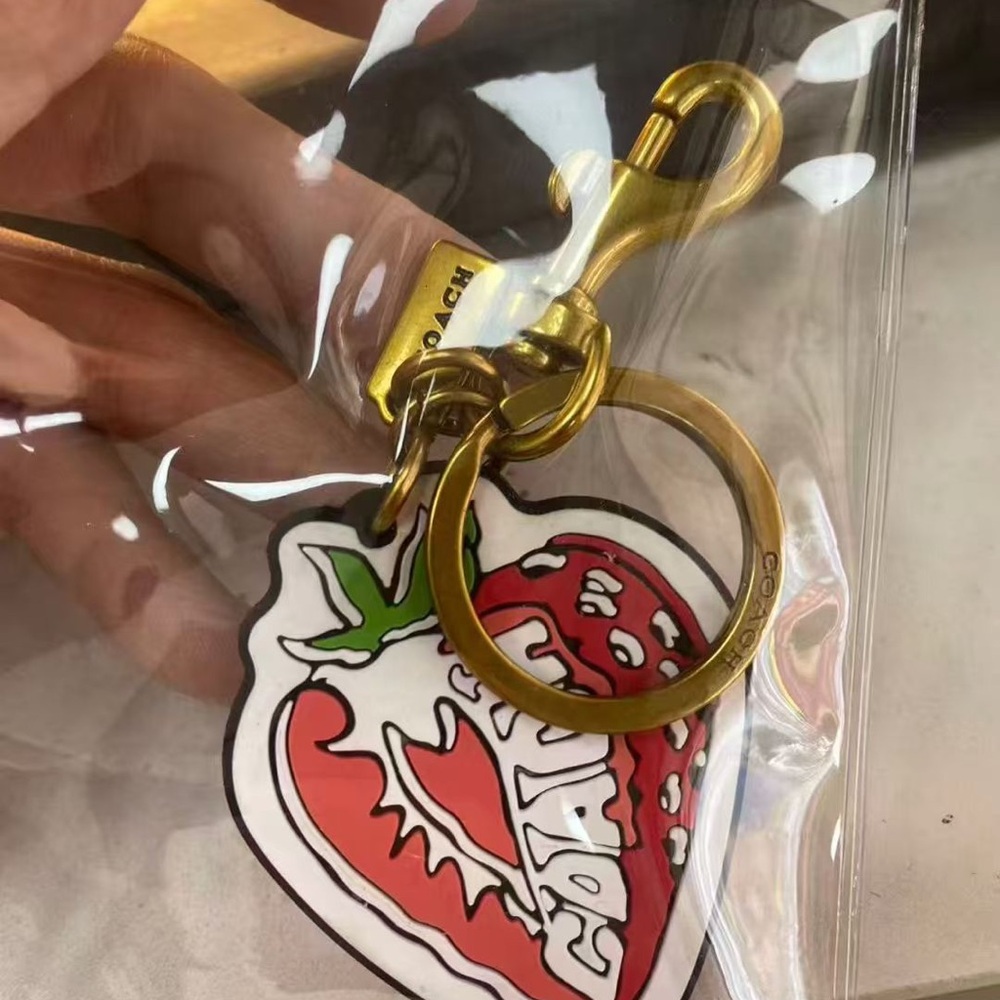 Coach Gold-Tone Strawberry Charm Key Ring with Red & Green Accent